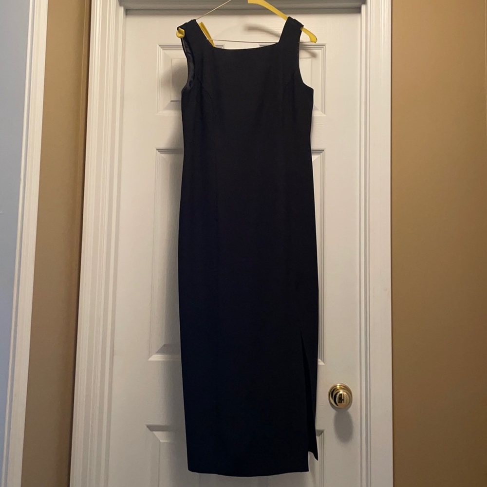Little black dress, scalloped in the back.